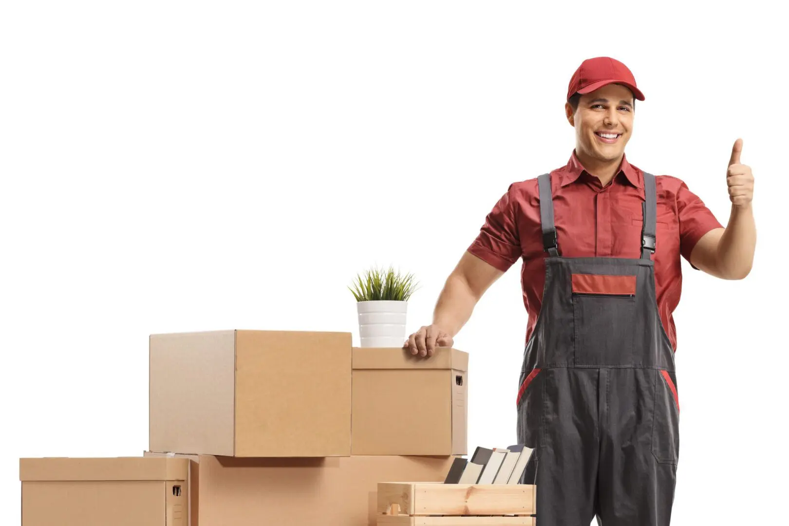 Smiling mover giving a thumbs-up beside boxes.